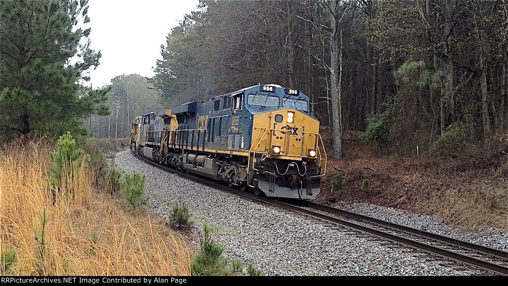 CSX 956 leads 245 and UP 7643 and 6031 to a red signal